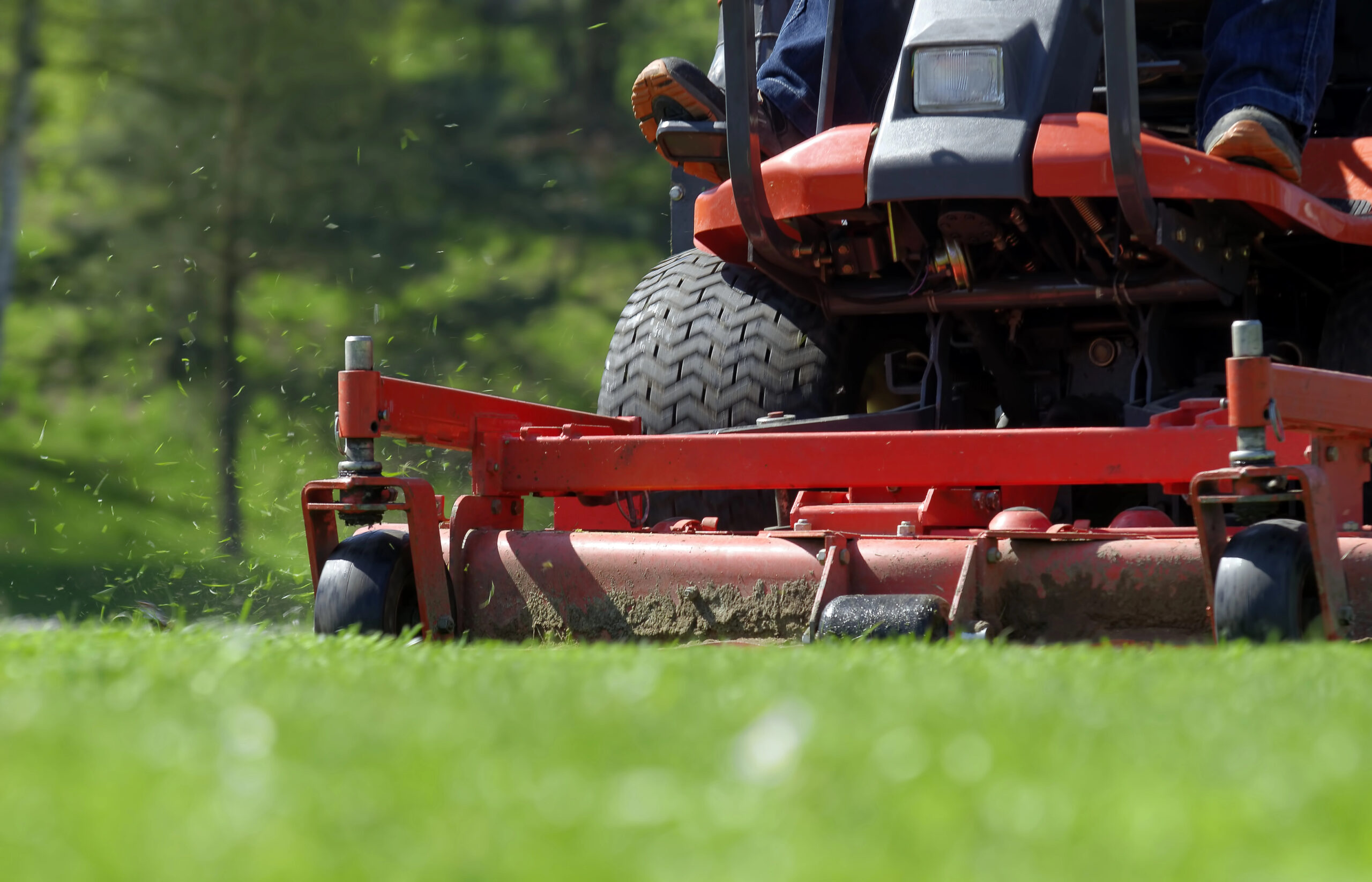 A close-up of a riding lawn mower for commercial and retail landscaping services
