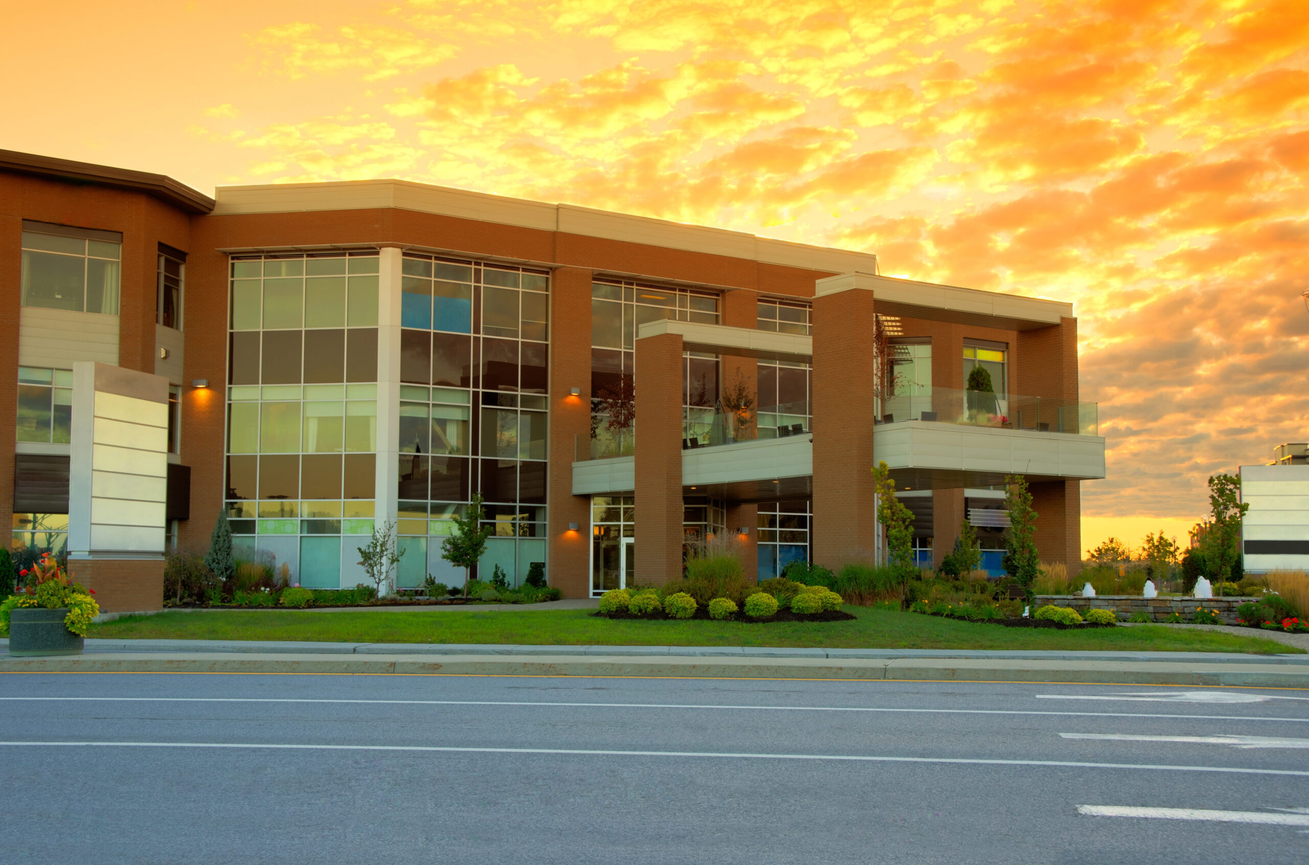 Commercial building with sunrise background