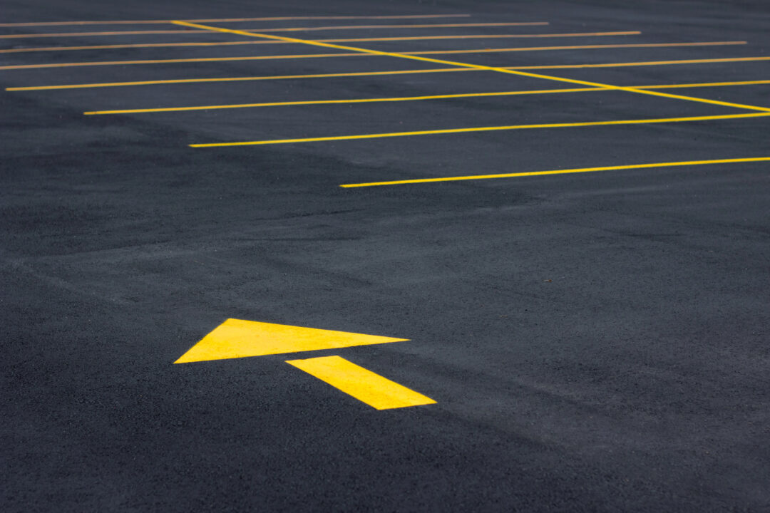 A yellow directional arrow in the road