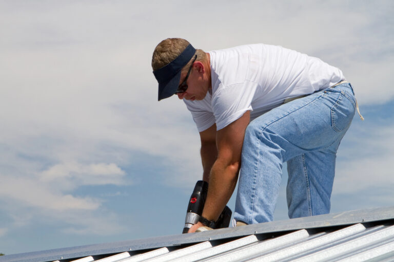 A man working on a commercial roof